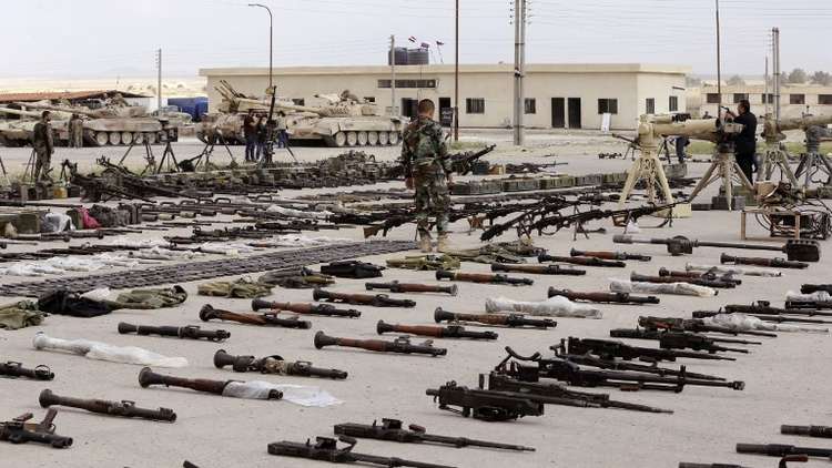 العثور بمستودعات المسلحين في حمص على اسلحة وصواريخ من حلف الناتو