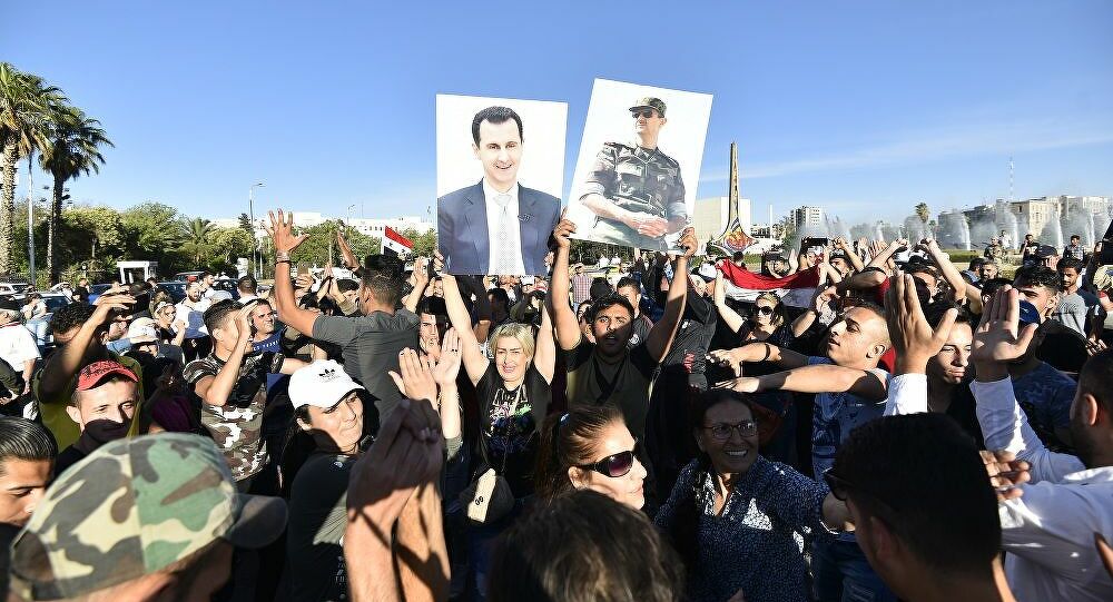 تجمع جماهيري في دمشق تأييدا للاسد والجيش السوري، وتنديدا بـ
